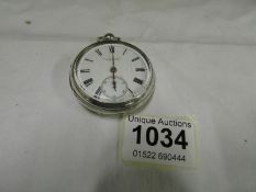 A silver pocket watch marked Skarrat & Co. Worcester