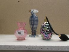 A glass perfume bottle and 2 vases