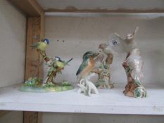 A Kingfisher, blue tits and dove figures