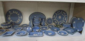 A large quantity of blue Wedgwood Jasper ware, approximately 30 pieces