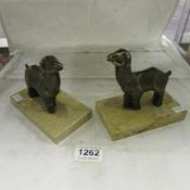 A pair of French Deco bronzed spelter sheep on marble bases book ends