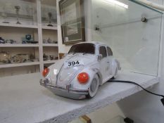 A table lamp in the form of a Volkswagen Beetle car