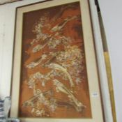 A painting on fabric of leaping fish
