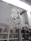 A floral single lamp chandelier