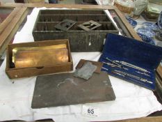 A quantity of brass stencils, maths set etc