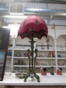 An Egyptian style table lamp with shade