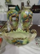 A pair of Staffordshire vases and matching rose bowl