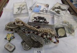 A good lot of costume jewellery, hat pins, bright stone belt a/f, agate necklace, brooch etc