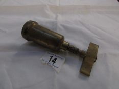 A vintage brass corkscrew