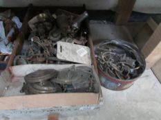 A tin and box of cabinet handles etc