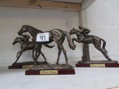 A model of Shergar with jockey, Desert Orchid with jockey and Red Rum without jockey