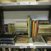 A large collection of books on British art, one shelf