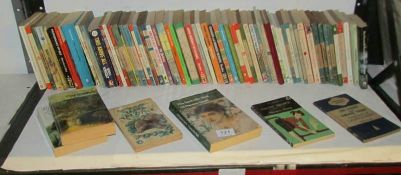A mixed lot of vintage paperback books, (one shelf)