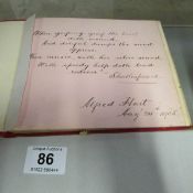 An early 20th century autograph book with various drawings and autographs