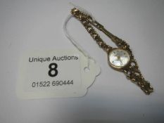 A 9ct gold Accurist ladies wristwatch on gold bracelet