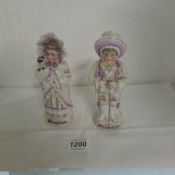 A pair of Victorian bisque Grandma and Grandpa figurines