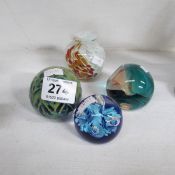 4 glass paperweights and a vase