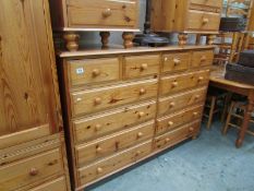 A large pine chest of 4 over 8 drawers