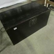 A dark stained blanket box