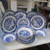 19 blue and white willow pattern plates and dishes