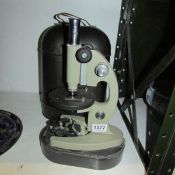 A metal cased microscope