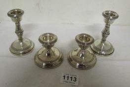2 pairs of silver candlesticks