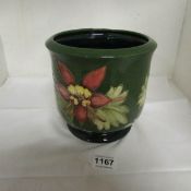 A large green Moorcroft planter with Fuschia decoration