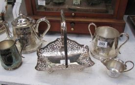 A 3 piece silver plate tea set, silver plate basket and jug