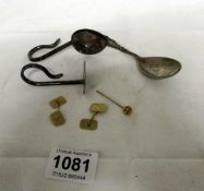 A pair of gold cuff links, a stick pin, silver baby spoon and pusher and silver spoon