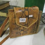 A vintage snake skin handbag