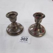 A pair of HM silver silver candlesticks