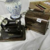 An Edison Gem phonograph with approximately 120 wax cylinders and some empty boxes