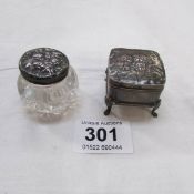 A HM silver cherub pill box and silver lidded glass pot