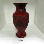 A red glazed Oriental vase, a/f