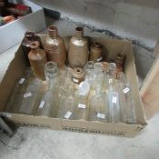 A quantity of glass and stoneware bottles