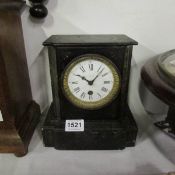 A black slate mantel clock