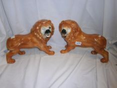 A pair of Staffordshire lions, a/f