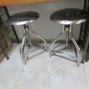 A pair of chrome stools