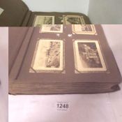 An 'Artistic series 1909' postcard album with approximately 335 old postcards