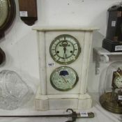 A marble mantel clock incorporating barometer