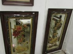 A pair of framed floral paintings on glass