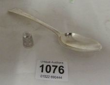 A Georgian silver spoon and a silver thimble