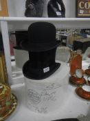 A silk top hat, a bowler hat and a Lockes hat box