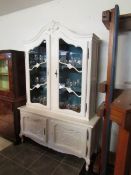 A painted French style display cabinet