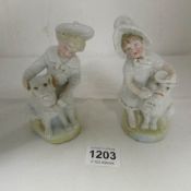 Early German boy and girl figurines with dogs