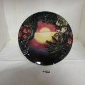 A Moorcroft 'Millenium' plate, beach sunset scene