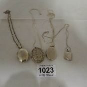 4 silver lockets on silver chains