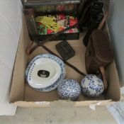 A box of miscellanea including binoculars, matchbox labels etc