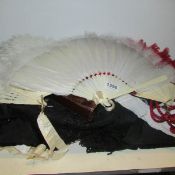 A mixed lot of vintage clothes, fans etc