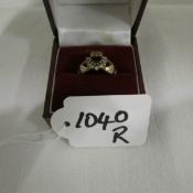 A 9ct gold sapphire Claddagh ring